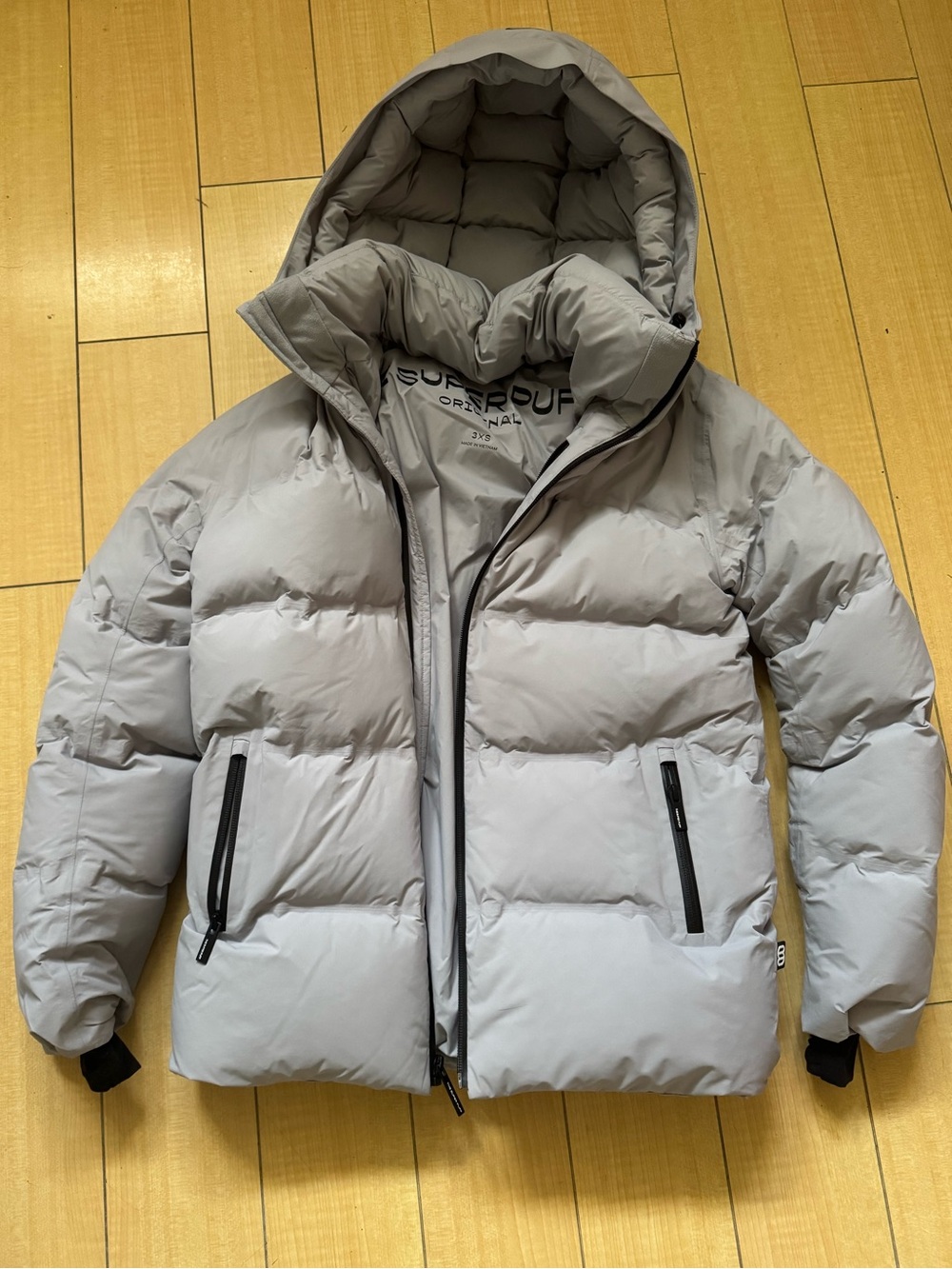 Light grey waterproof Aritzia Super Puff